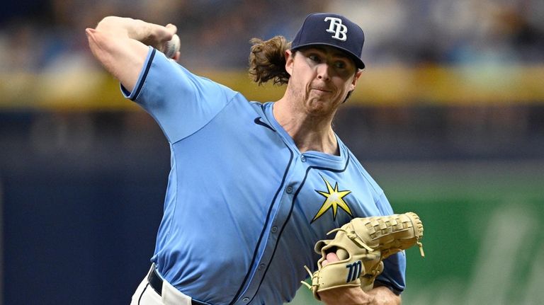 Tampa Bay Rays pitcher Ryan Pepiot throws to home plate...