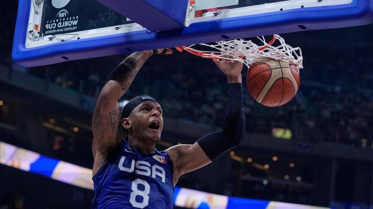 U.S. forward Paolo Banchero (8) dunks the ball during the...