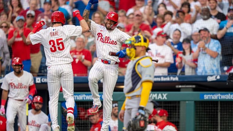 Philadelphia Phillies' David Dahl (35) reacts after his home run...