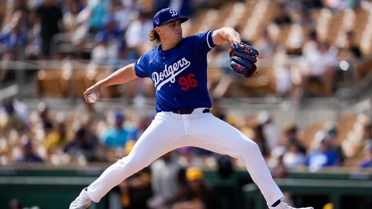 Los Angeles Dodgers starting pitcher Landon Knack throws during the...