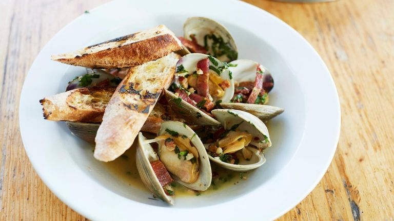 Steamed littleneck clams with chorizo, lemon and parsley at Five...