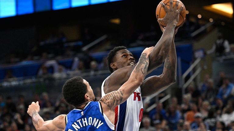 Detroit Pistons center Jalen Duren, right, is fouled by Orlando...