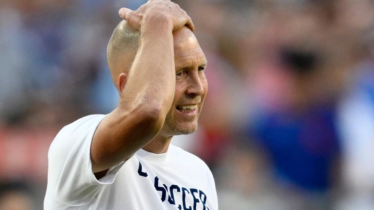 Untied States coach Gregg Berhalter reacts during the first half...