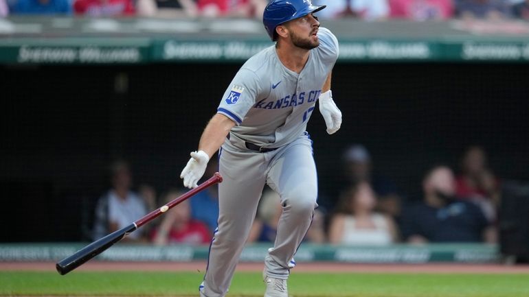 Kansas City Royals' Paul DeJong watches his home run in...