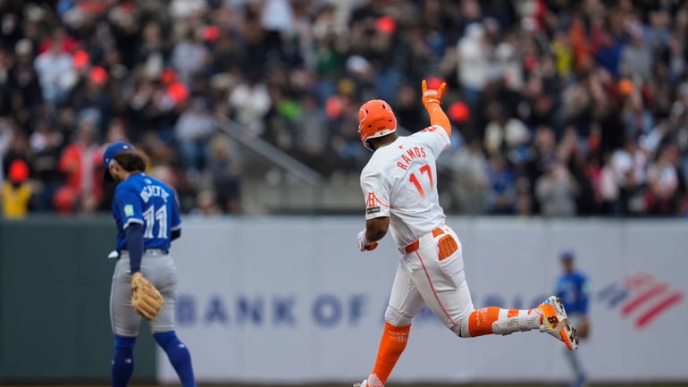 San Francisco Giants' Heliot Ramos (17) runs the bases after...