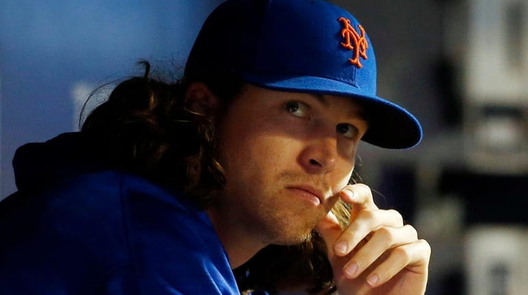 Jacob deGrom of the New York Mets looks on during...