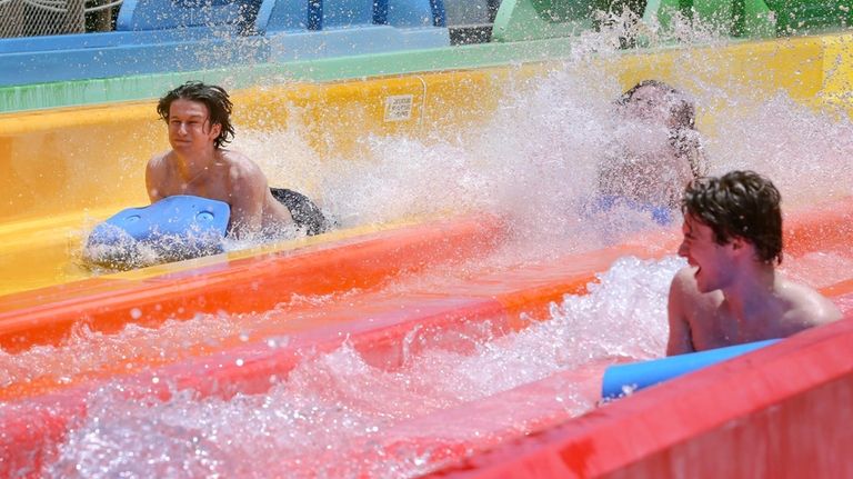 Visitors to the Splish Splash water park in Calverton ride...