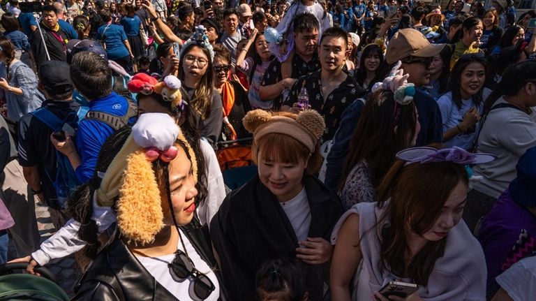 Visitors enter the World of Frozen themed area during its...