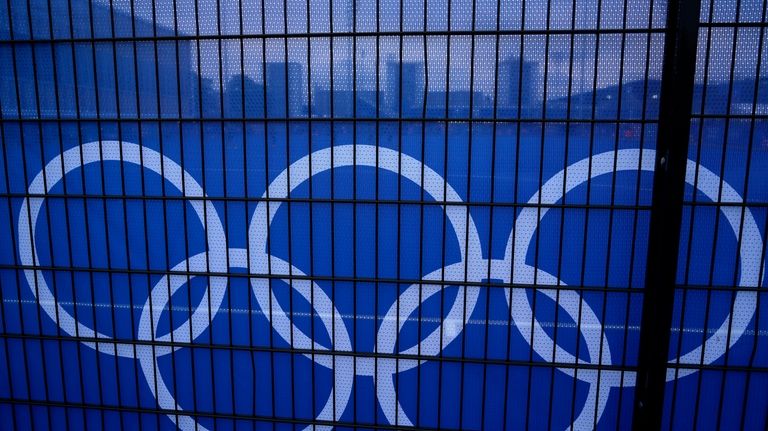 The Olympic rings are pictured at the Yves-du-Manoir Stadium at...