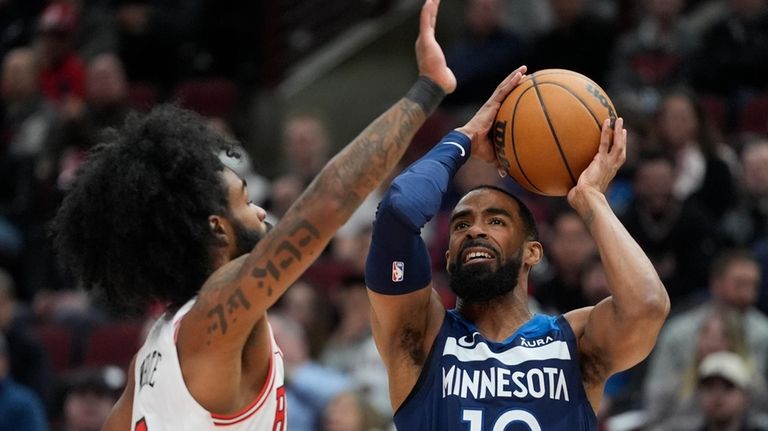 Minnesota Timberwolves guard Mike Conley shoots against Chicago Bulls guard...