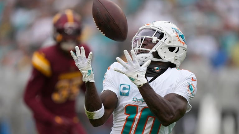 Miami Dolphins wide receiver Tyreek Hill (10) catches a touchdown...