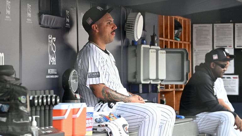 Yankees starting pitcher Nestor Cortes sits in the dugout after...