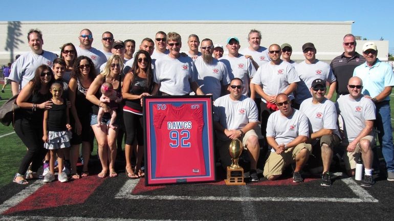 Island Trees High School's 1992 football champions -- with cheerleaders,...