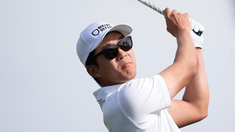 Michael Kim hits toward the eighth fairway at the Nicklaus...