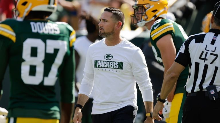 Green Bay Packers head coach Matt LaFleur watches as his...