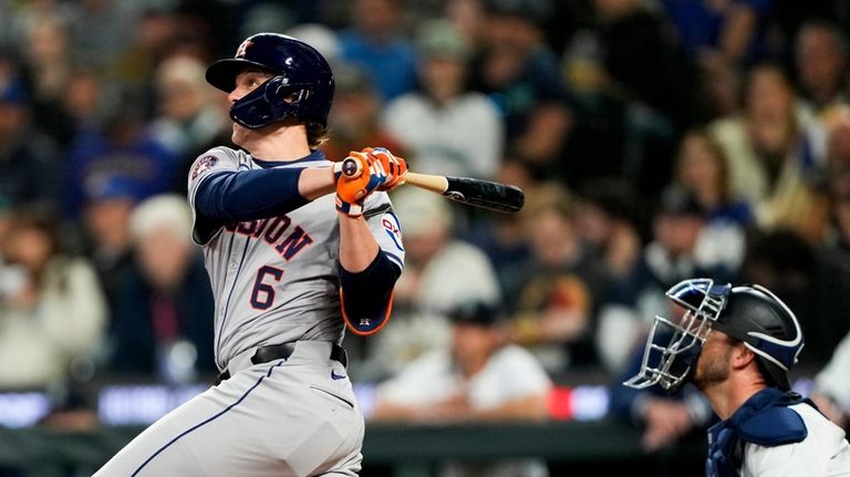 Houston Astros' Jake Meyers hits an RBI single as Seattle...