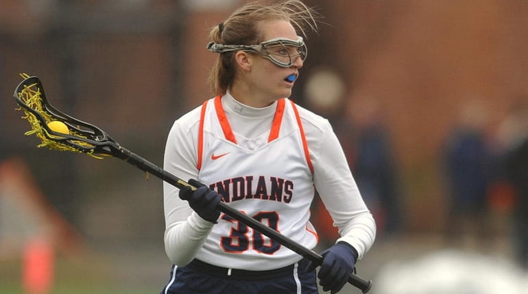 Kelly Trotta of Manhasset carries downfield during a Nassau girls...