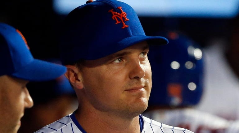 Jay Bruce of the Mets looks on from the dugout...