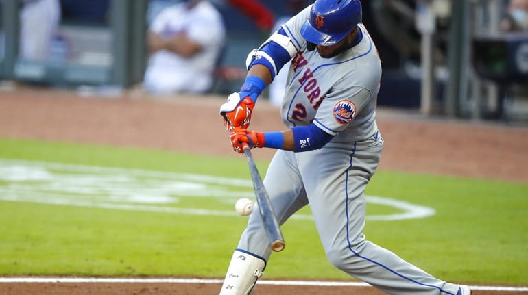 Robinson Cano of the New York Mets knocks in two runs...