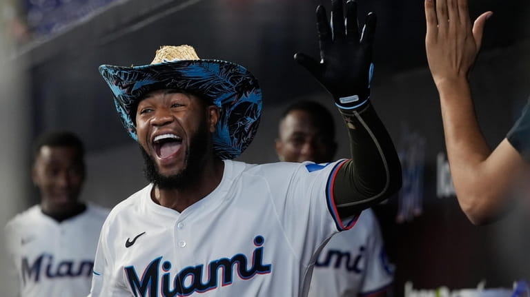 Miami Marlins' Bryan De La Cruz smiles after hitting a...