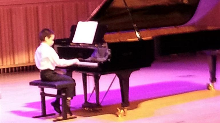 Kidsday reporter Sebastian Murillo performs on the piano.