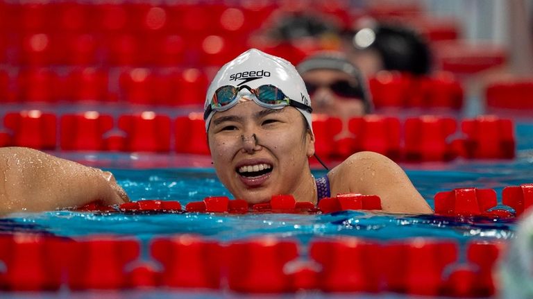 Paralympic athlete Pin Siu Yip, of Singapore, celebrates her victory...