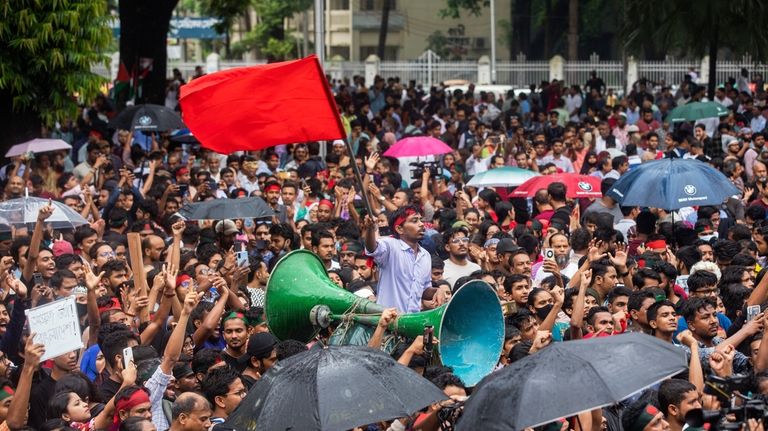 Activists take part in a protest march against Prime Minister...