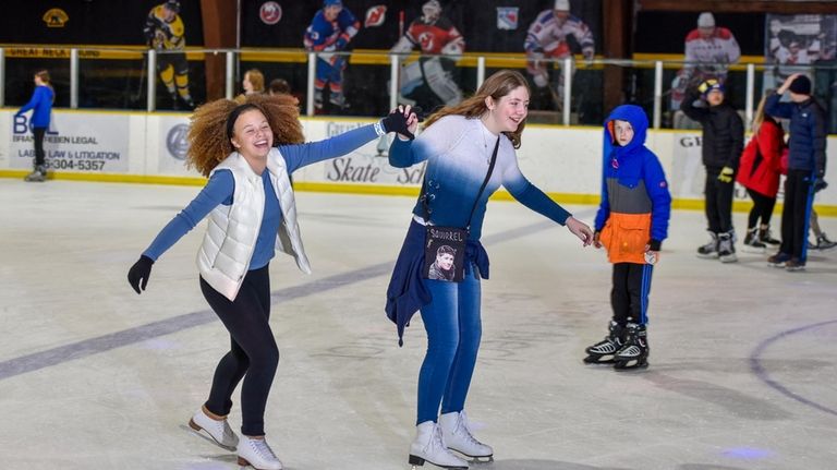 Sarah Castro-Tie and Bethany Bernatouich ice skate at Andrew Stergiopoulos...