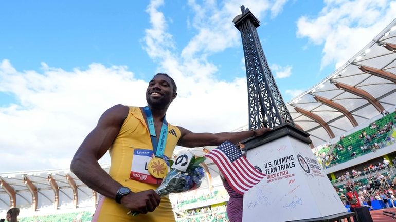 Noah Lyles celebrates after winning the men's 200-meter final during...