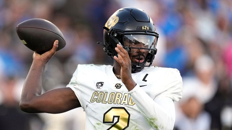 Colorado quarterback Shedeur Sanders passes during the first half of...