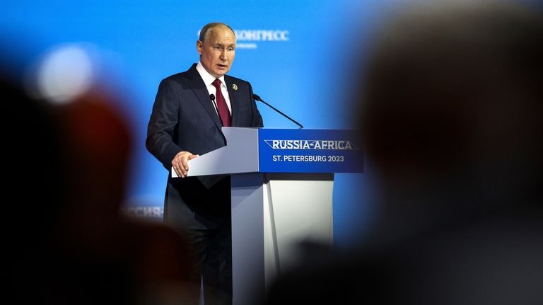 Russian President Vladimir Putin addresses the plenary session of the...