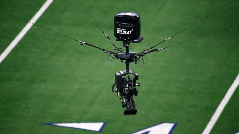 A Skycam WILDCAT is maneuvered over the field during an...