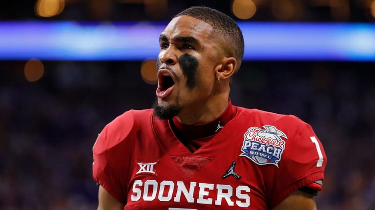 Quarterback Jalen Hurts #1 of the Oklahoma Sooners reacts from...