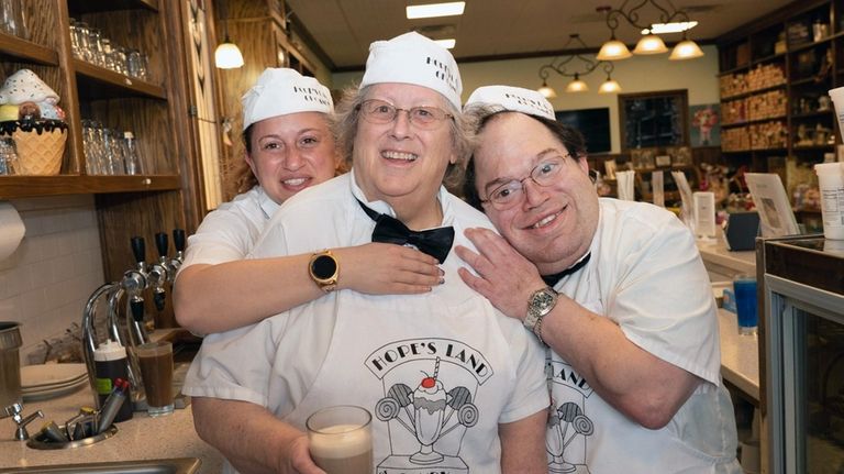 Joan Cohen, center, working with her daughter Hope Cohen and son...