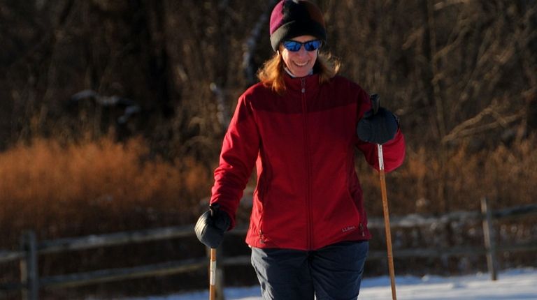 Cathy of Levittown takes advantage of the sunny but cold...