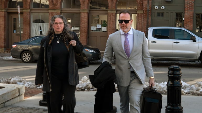 Dr. Merideth Norris walks into federal court in Portland, Maine,...