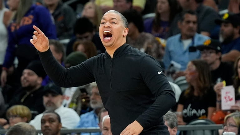 FILE -Los Angeles Clippers coach Tyron Lue shouts instructions to...