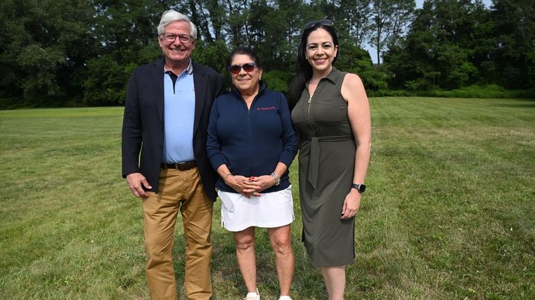 Port Washington North Mayor Robert S. Weitzner, left, Stella Spanakos,...