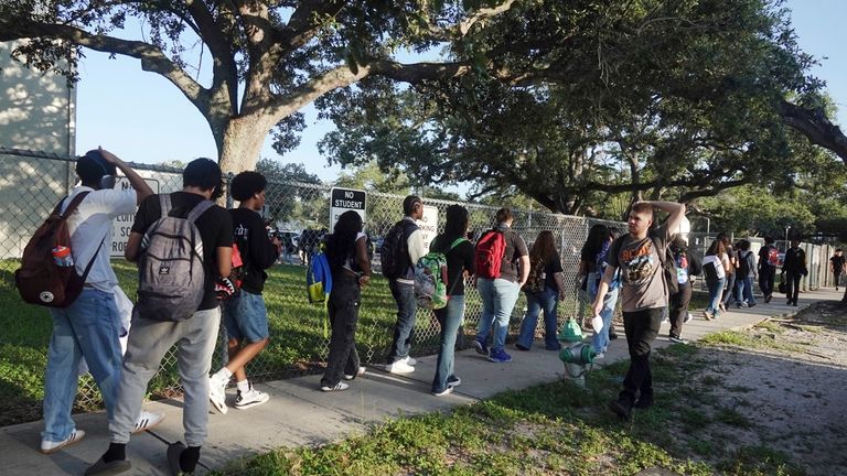 Students line up outside Hollywood Hills High School in Hollywood,...