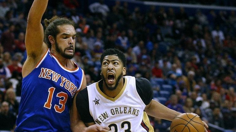 Anthony Davis of the New Orleans Pelicans drives against Joakim...