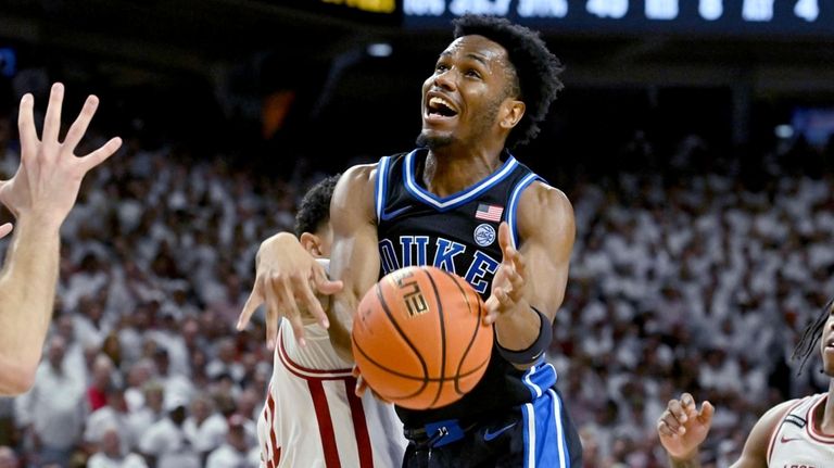 Duke guard Jeremy Roach (3) is fouled as he tries...