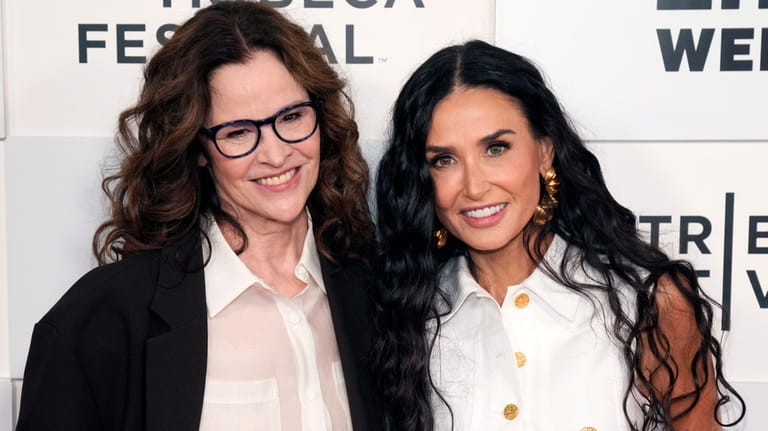 Ally Sheedy, left, and Demi Moore attend the "Brats" premiere...
