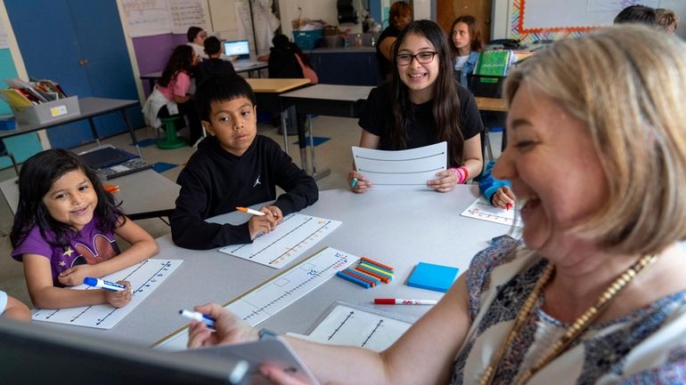 Fifth grade students attend a math lesson with teacher Jana...