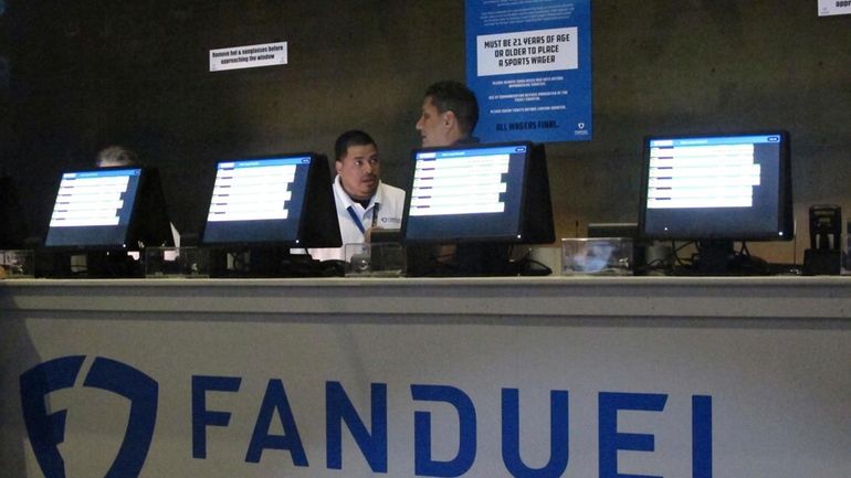 Workers at the FanDuel sports book at the Meadowlands Racetrack...