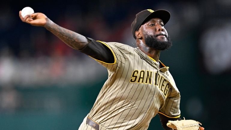 Padres relief pitcher Enyel De Los Santos throws during the...