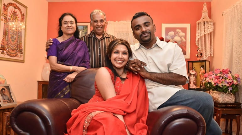 Balaji Raman, right, and his wife Sangeeta Akundi. She was...