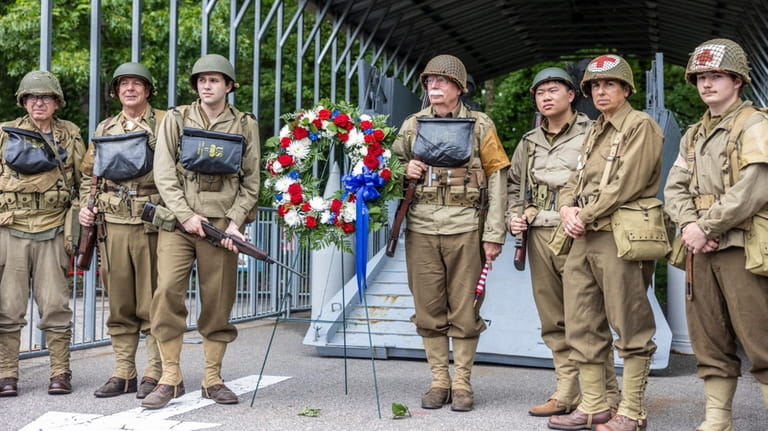 WW II re-enactors at the end of D-Day ceremonies at...
