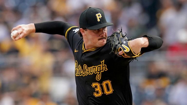 Pittsburgh Pirates starting pitcher Paul Skenes delivers during the first...