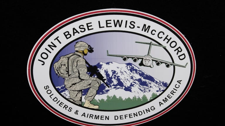 The logo of Joint Base Lewis-McChord is seen at a...