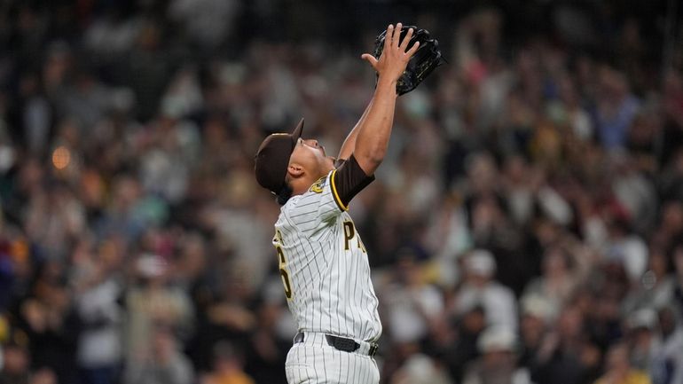 San Diego Padres relief pitcher Jeremiah Estrada celebrates after the...